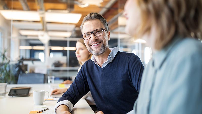 Staff having conversation in office