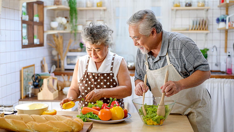 Older couple cooking in the kitchen
