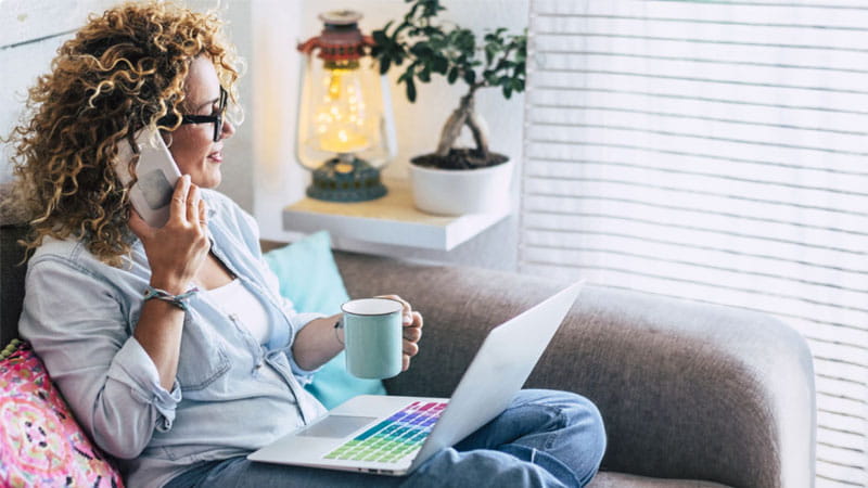 Woman on the phone sitting on the couch