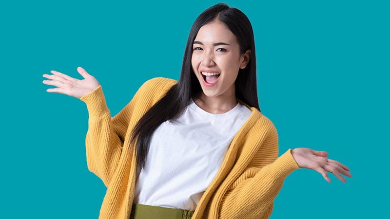 Young woman with arms up