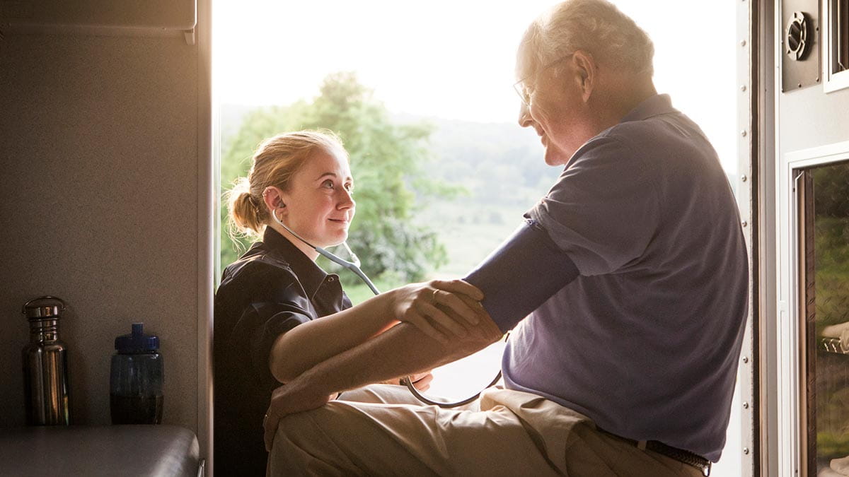 Elderly man with paramedic