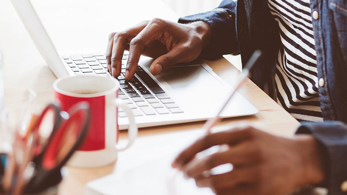 Person typing on lapto