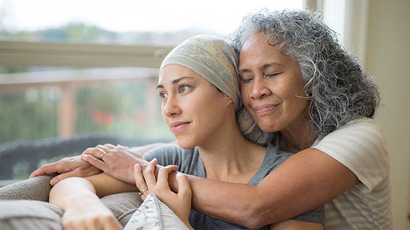 Mother wearing scarf with daughter