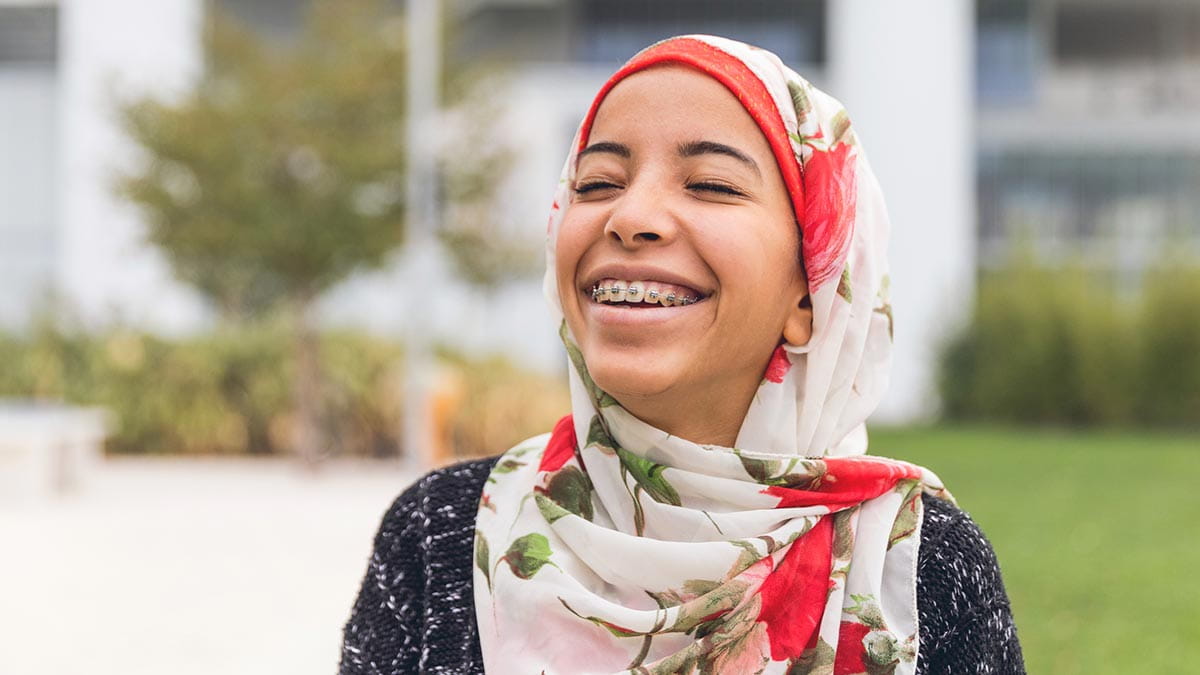Teenager with braces smiling