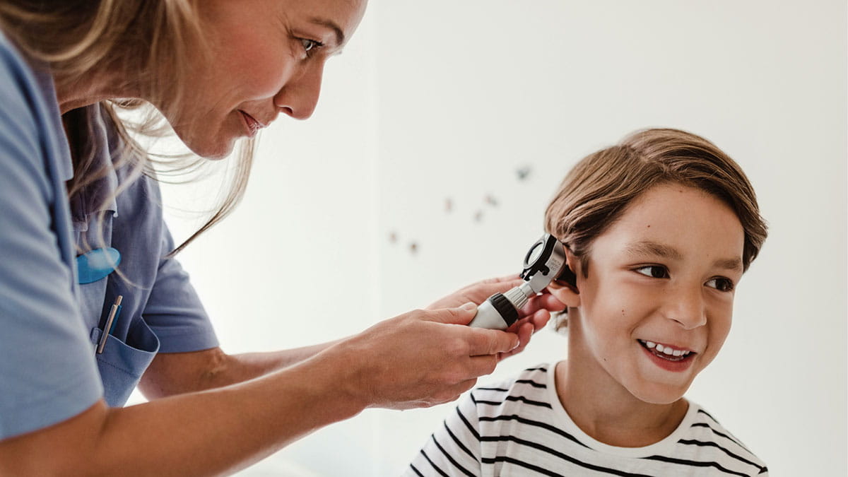 Boy getting his ears checked