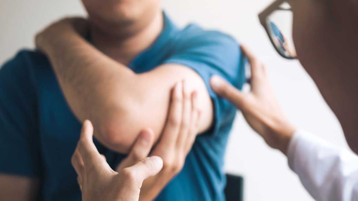 Physio helping patient