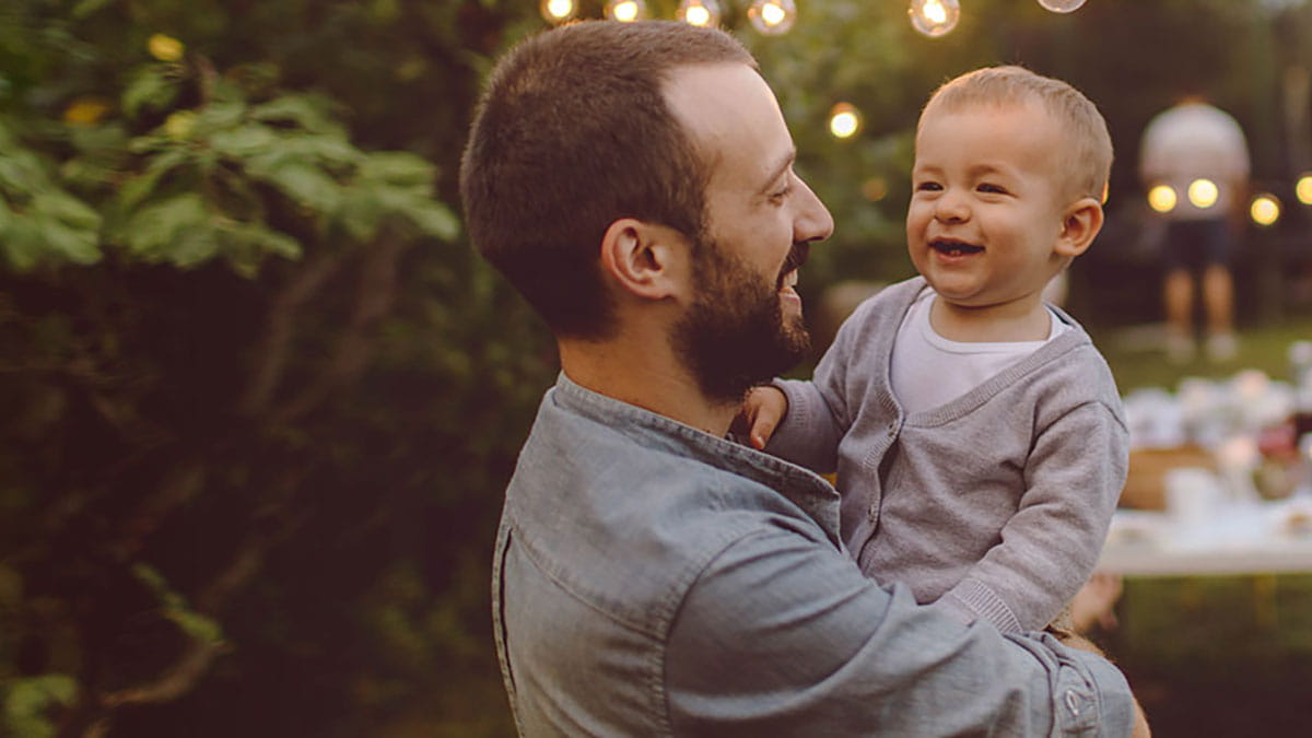 Father holding son