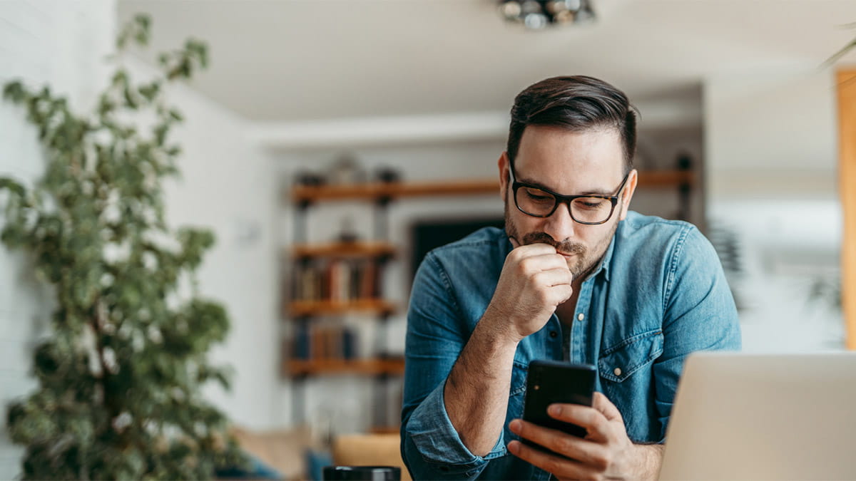 Man on mobile phone in home