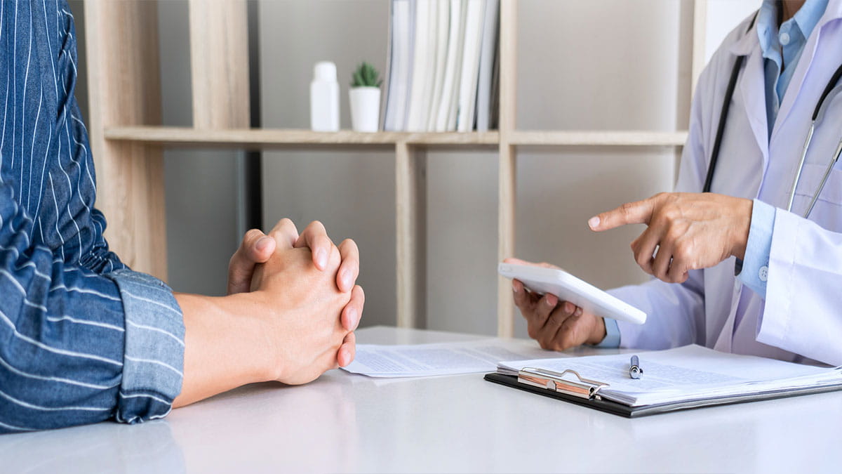 Person speaking to doctor