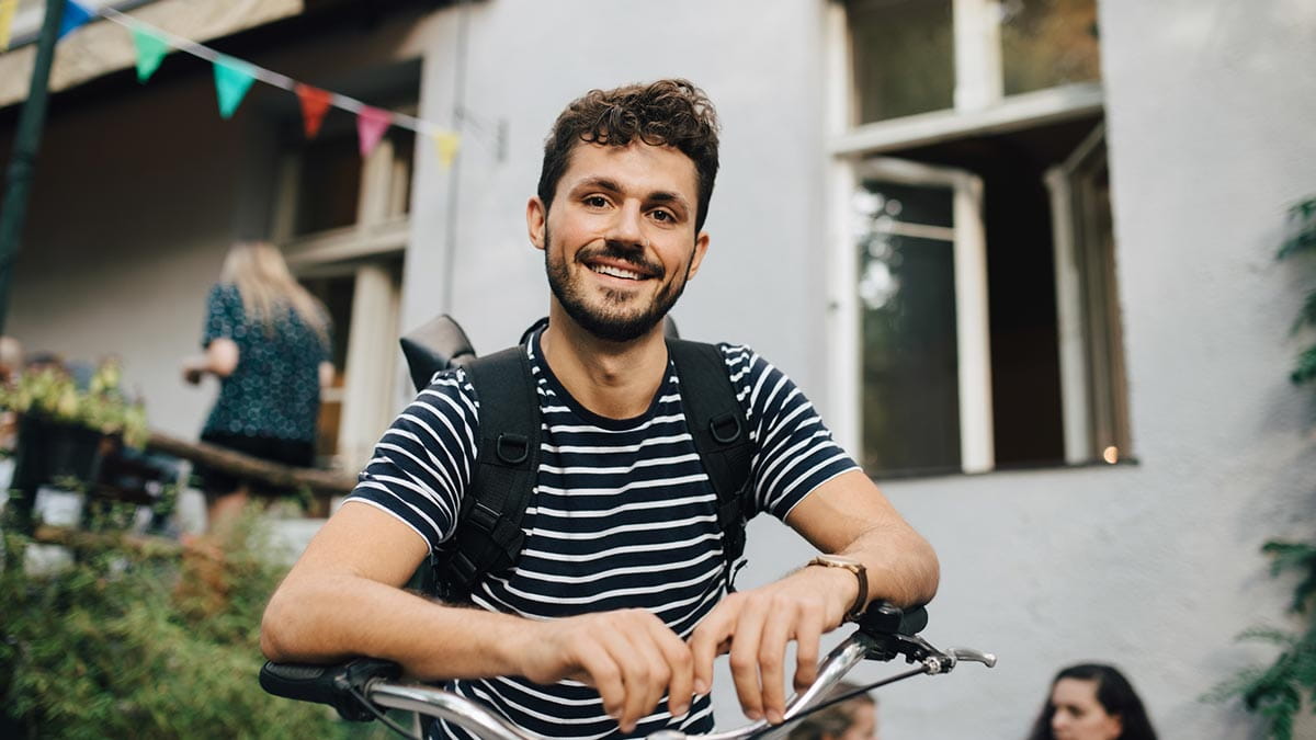 Man smiling on bike
