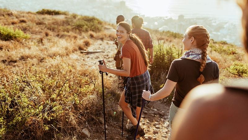Young women hiking in the sunlight