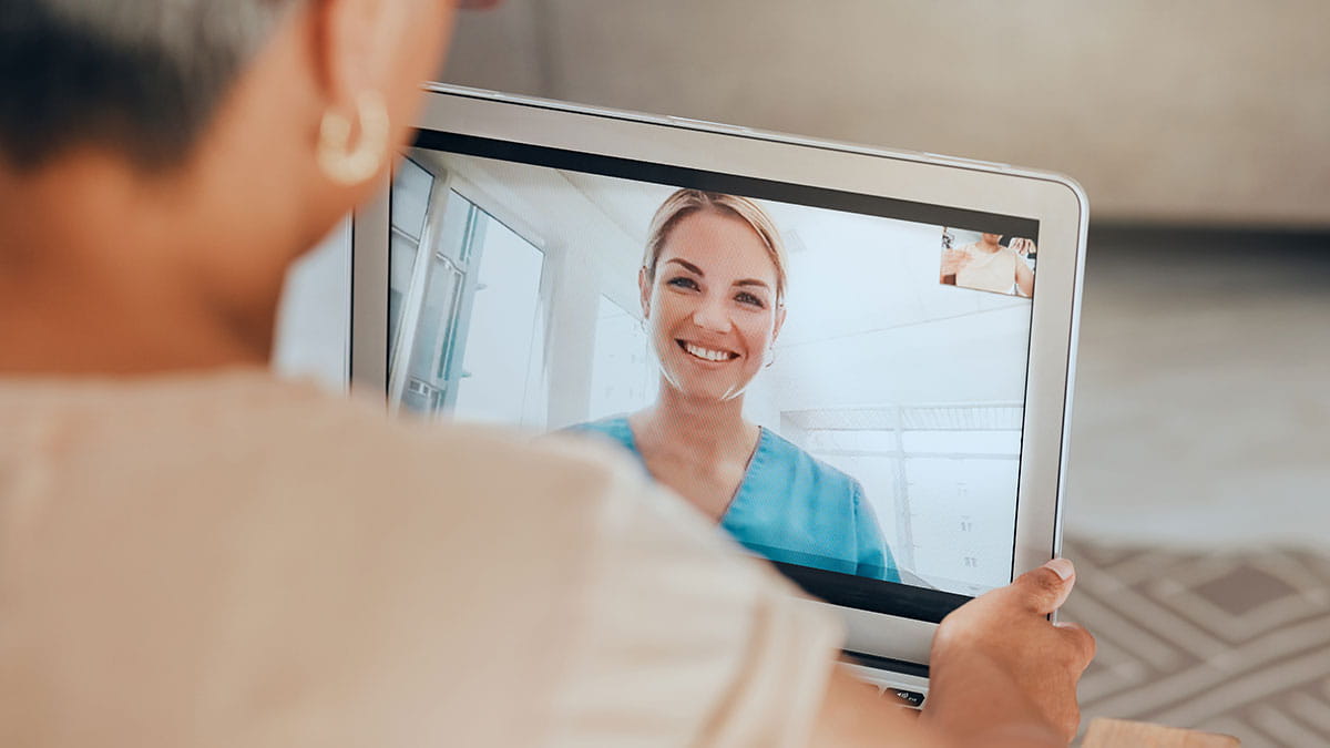 HBF member attending an online telehealth consultation with an Updoc partner doctor on a tablet device