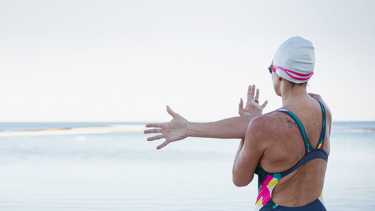 Woman swimmer stretching