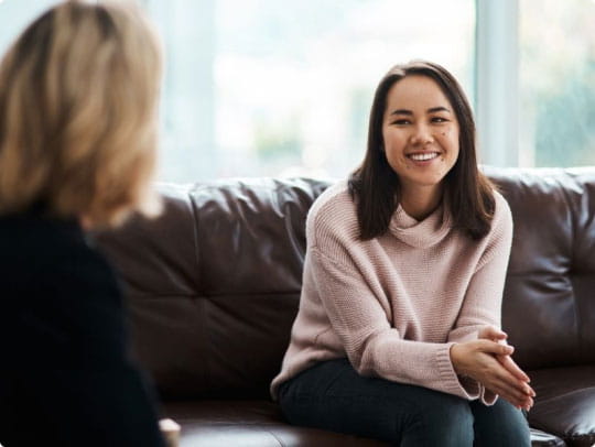 Woman sitting on couch