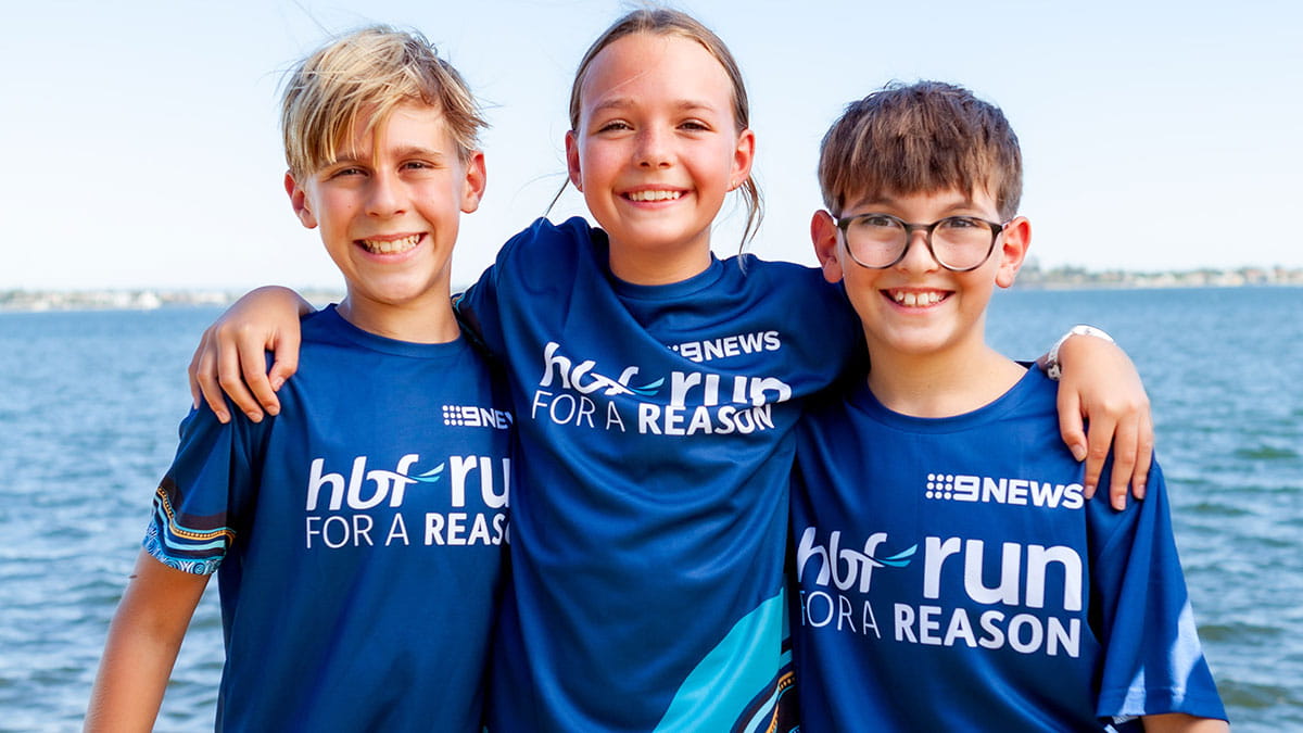 Three children wearing 2024 Run for a Reason t-shirt