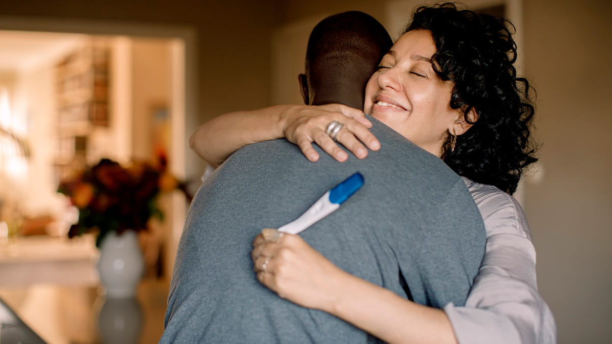 A couple with a pregnancy test