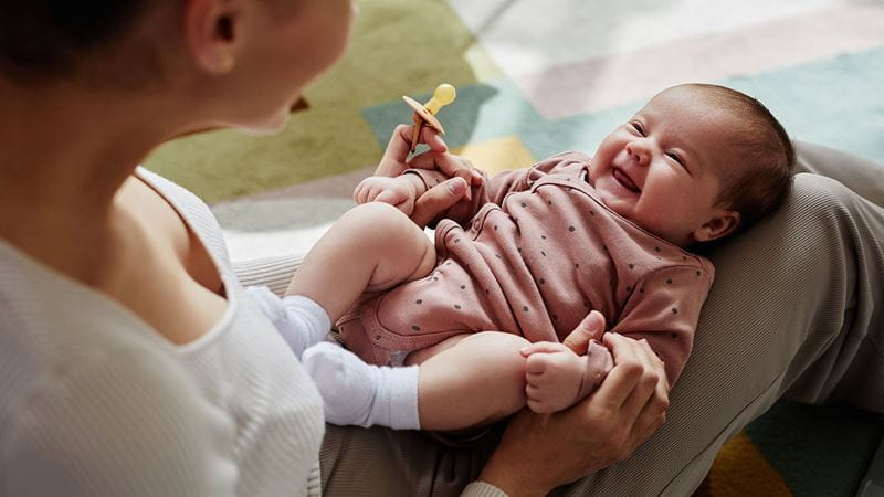 Baby smiling at parent