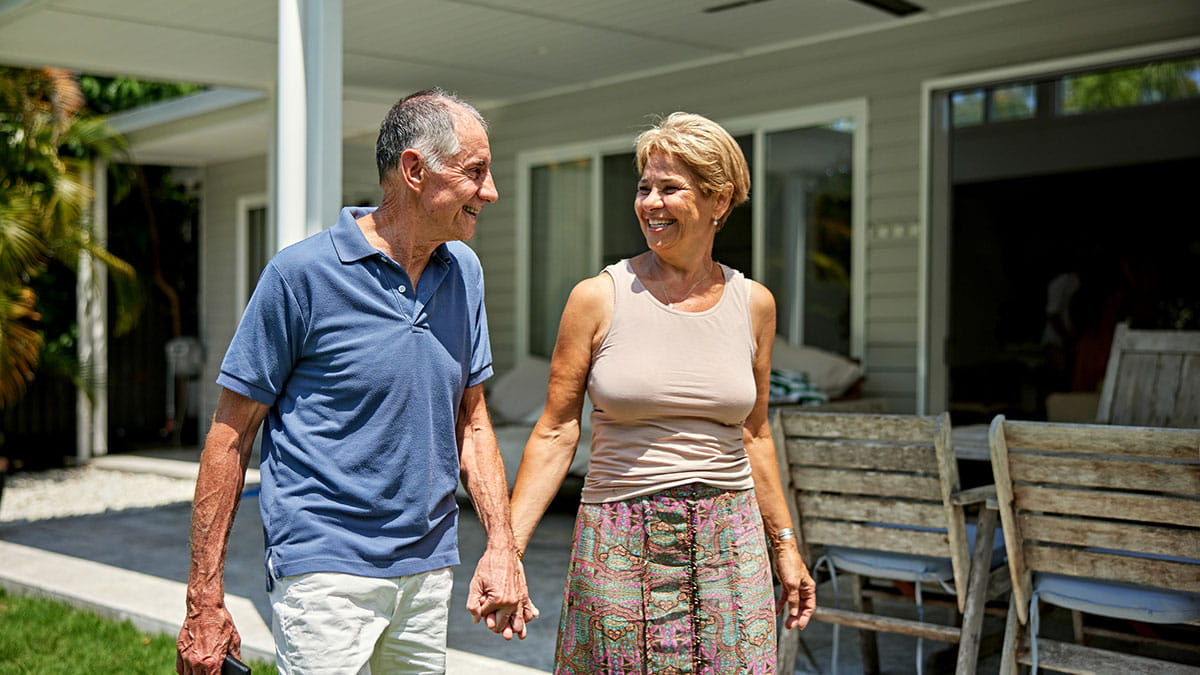 Older couple holding hands