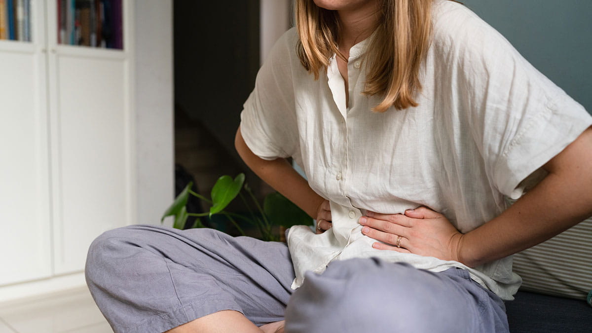 Woman holding her stomach