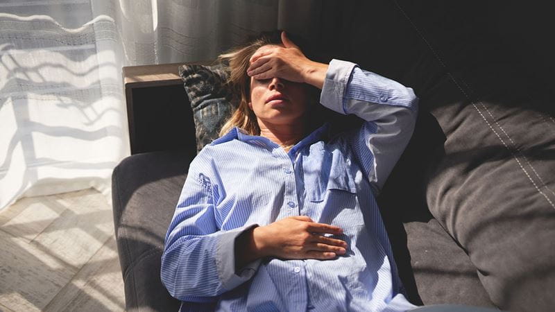 Woman holding her head