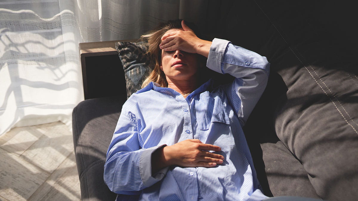 Woman holding her head