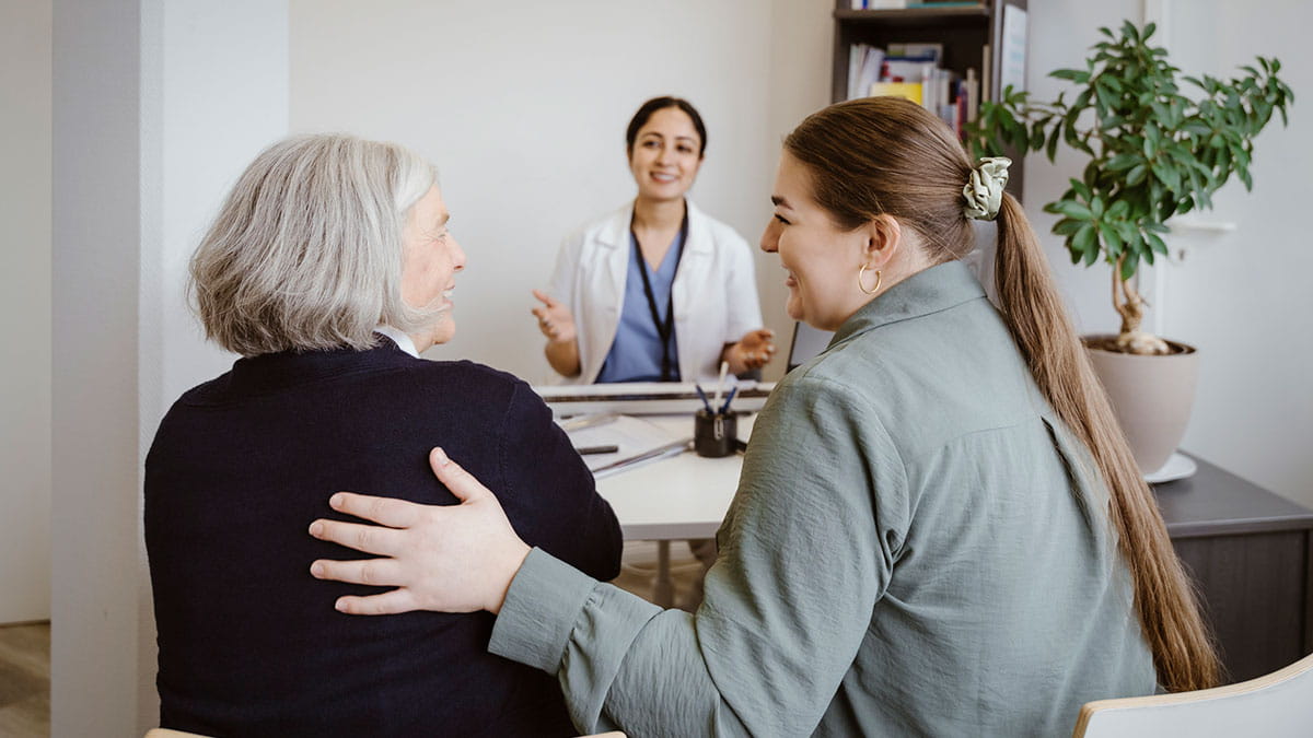 Doctor speaking to patients