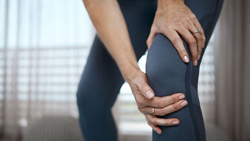 Person holding knee