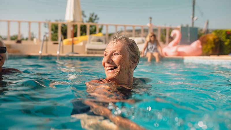 Smiling older woman in pool