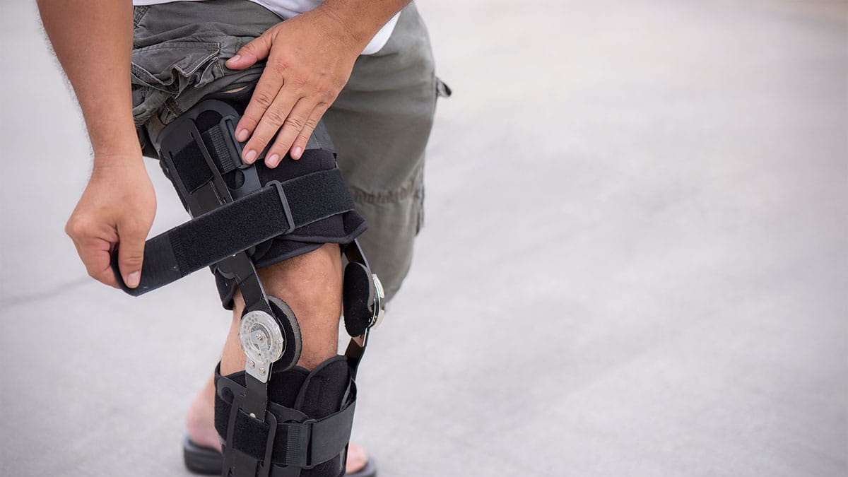Man in knee brace