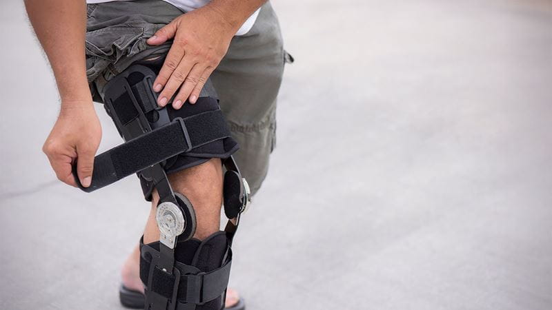 Man in knee brace