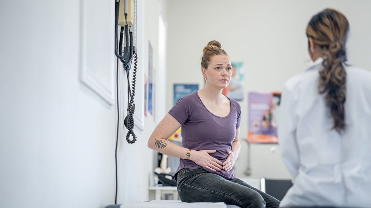 Woman holding her stomach