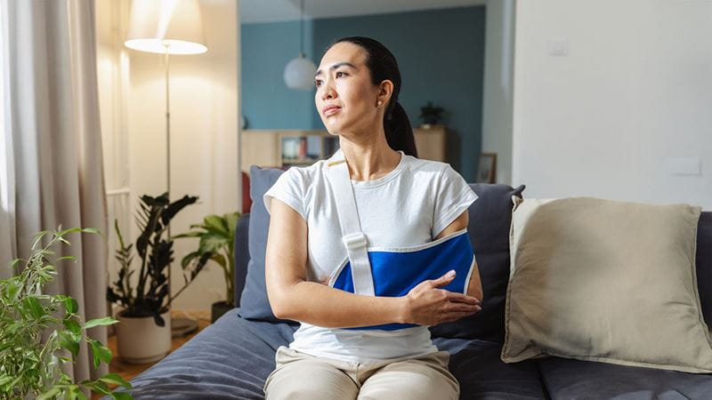 Woman with arm in sling