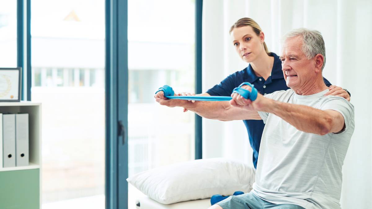 Female physiotherapist working with her male patient