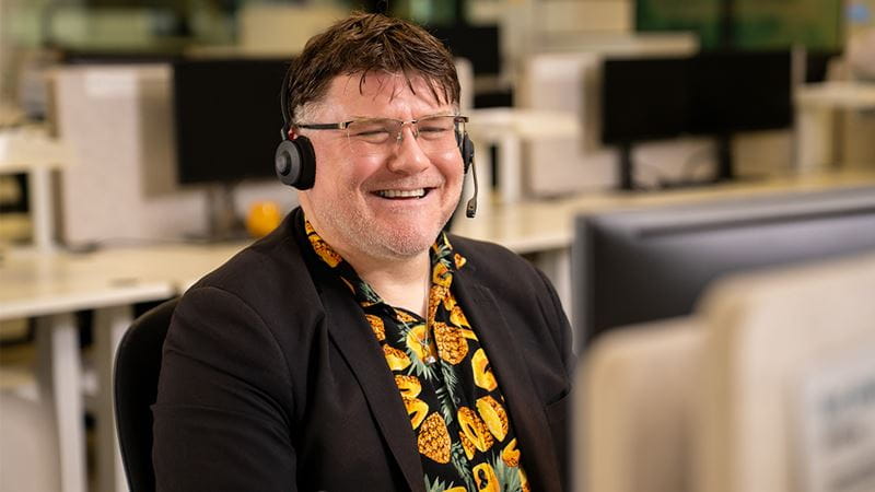 HBF contact centre consultant wearing a headset while assisting members from an office workstation.