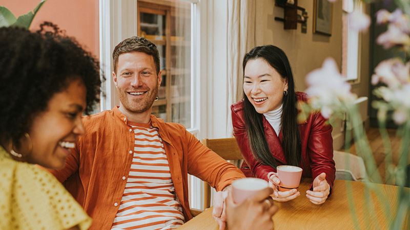 Three friends having coffee