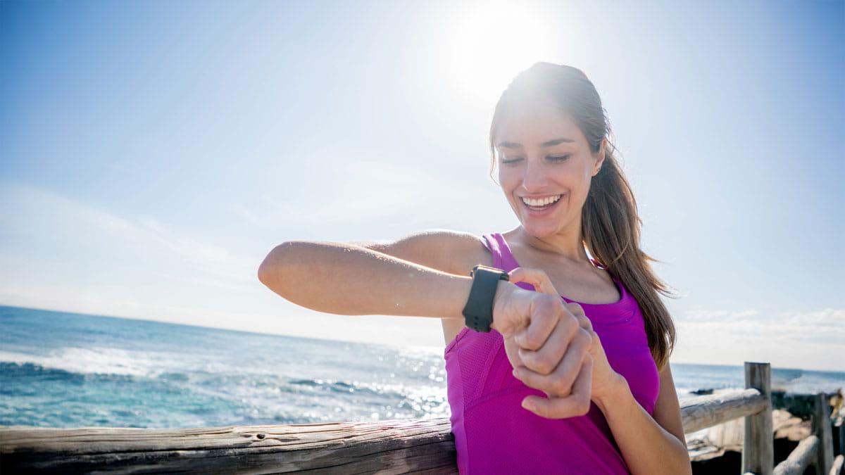 Woman looking at her smart watch