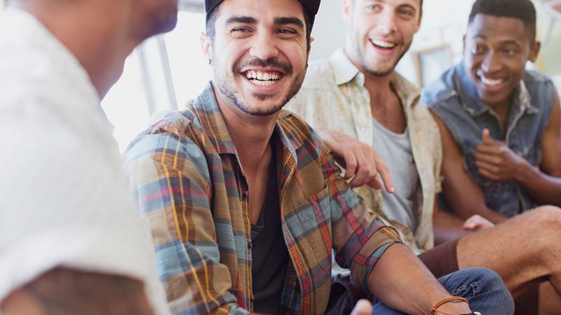 Four men laughing