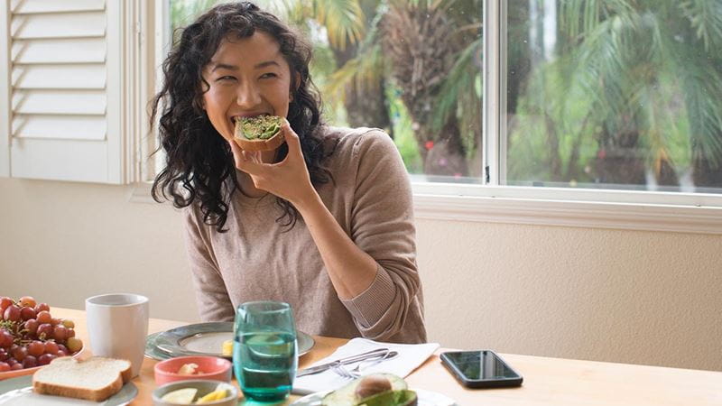 Woman eating apple