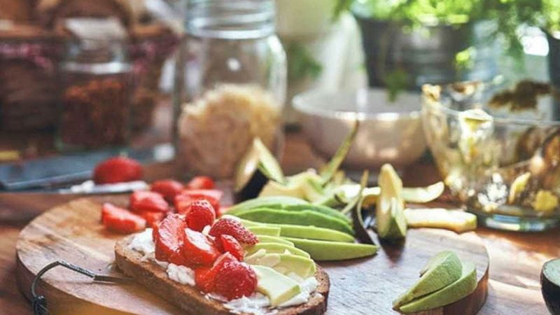 Platter of fresh fruit and vegetables on bread