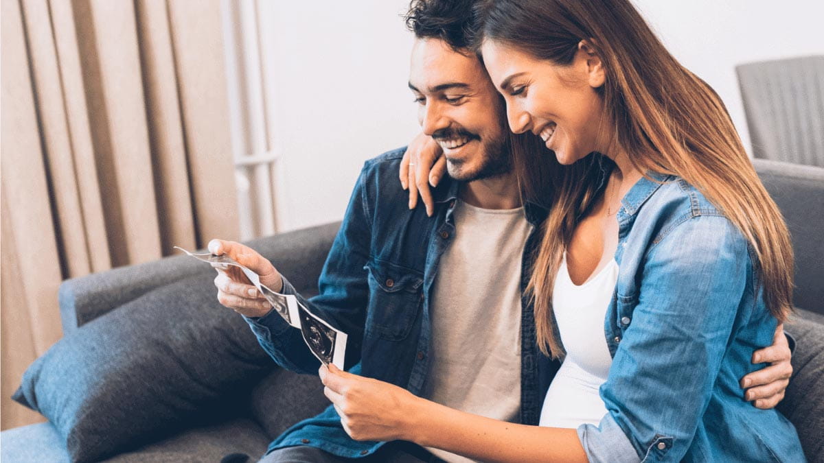 Couple looking at ultrasound pictures