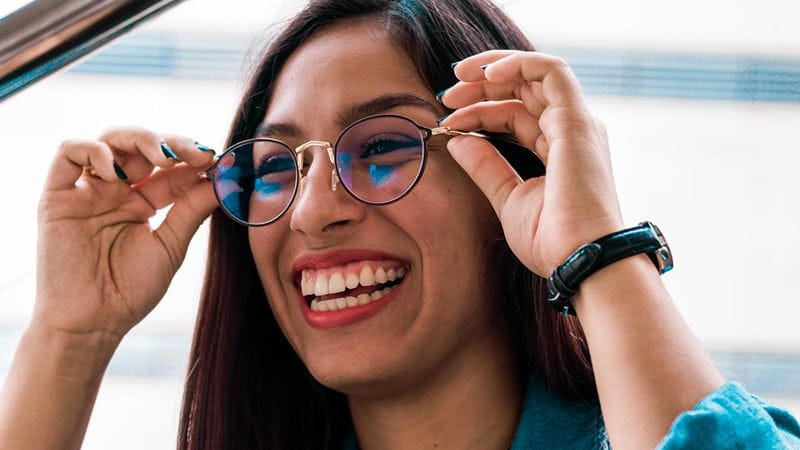 Woman smiling with glasses