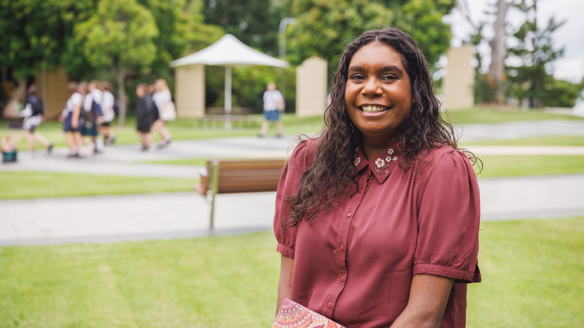 Teenage girl smiling at university