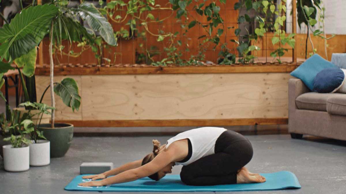 Woman doing a yoga child pose