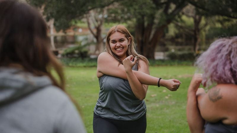 Young woman stretching before exercise