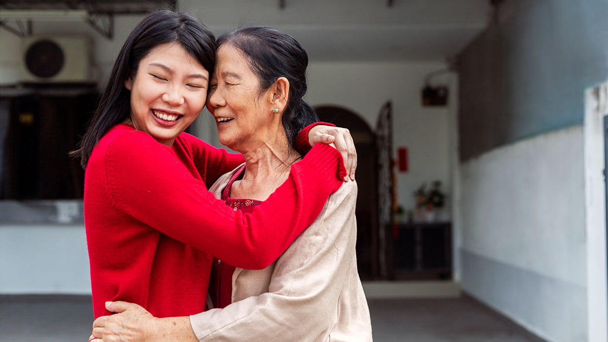 Mother and daughter hugging