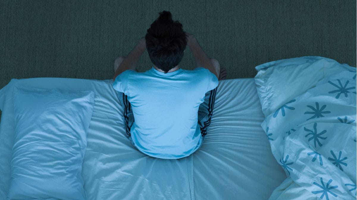 Man sitting on bed