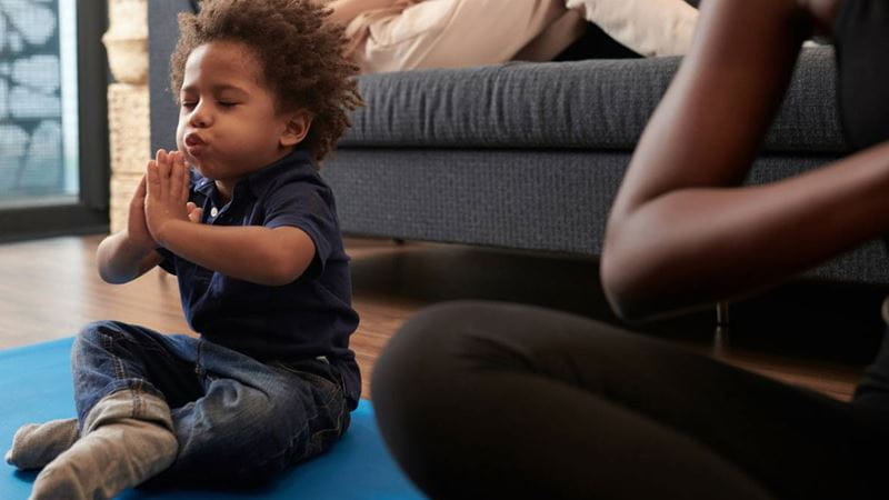 Young child practicing breathing exercises