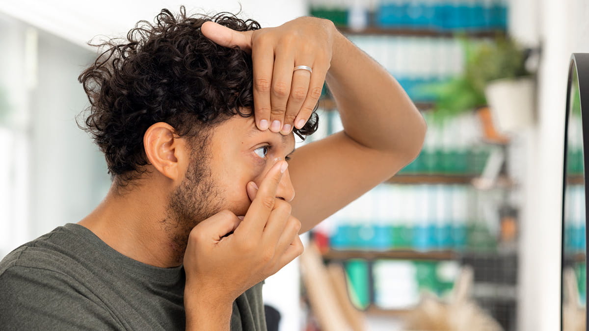 Man checking his eyes