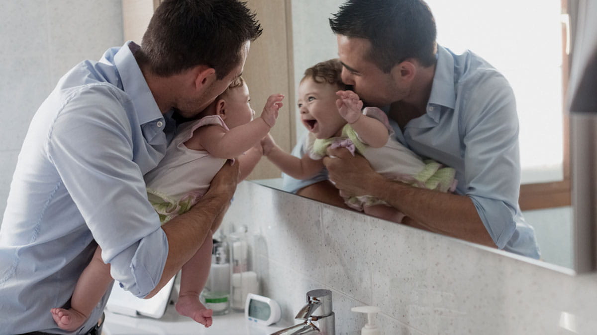 Dad playing with his baby
