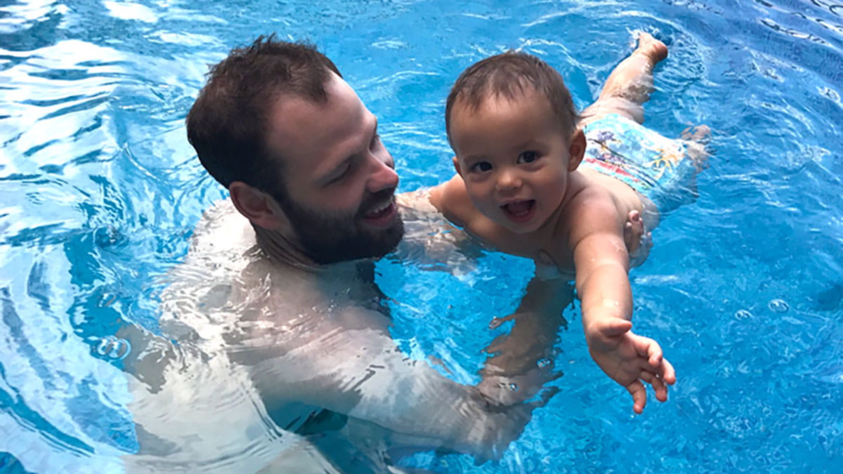 Father and child in swimming pool